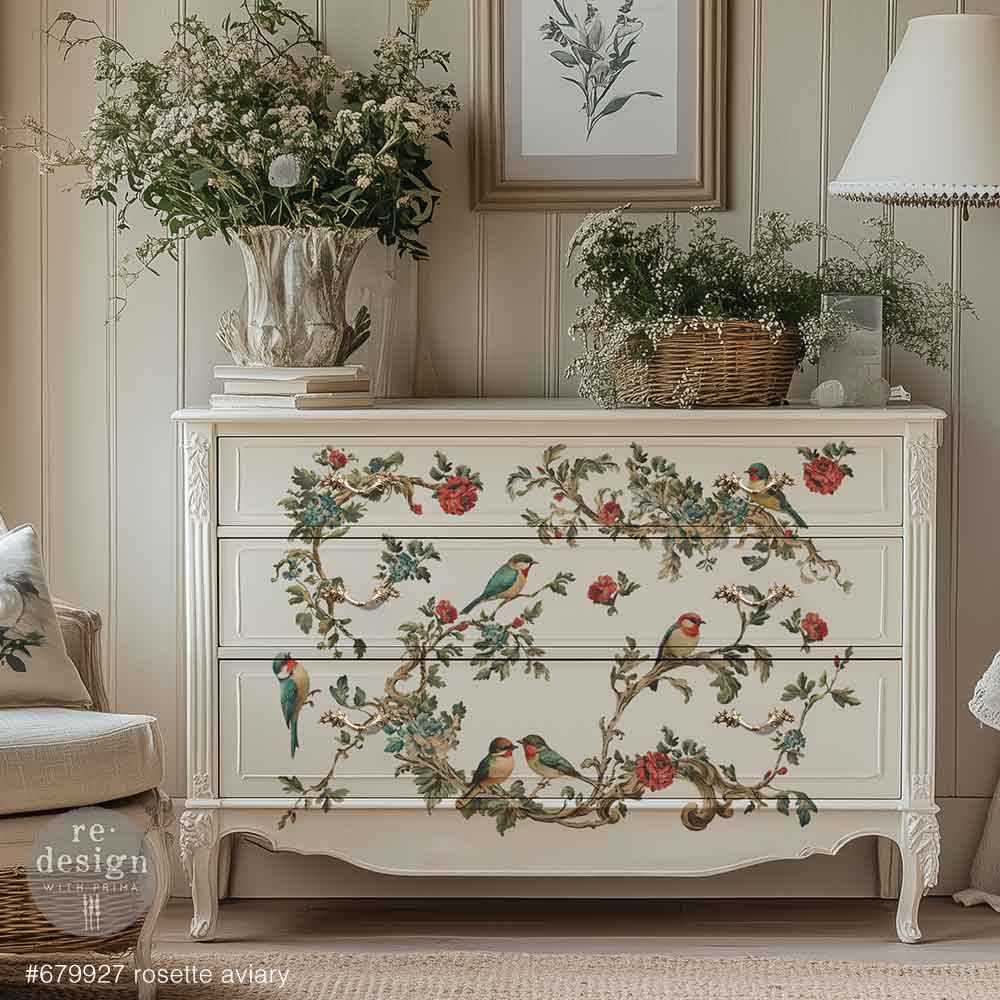 Decorative chest of drawers with floral and bird patterns in a room setting.