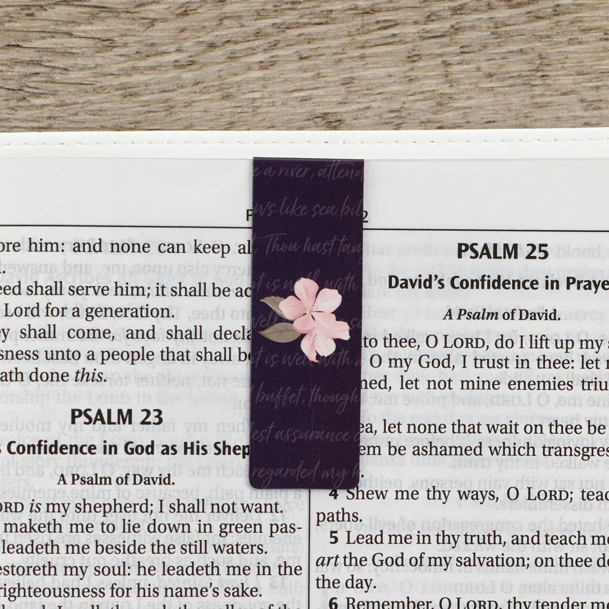 Floral bookmark on a page of a book with text