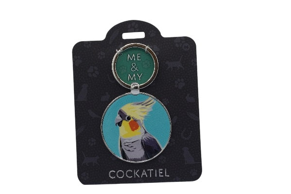 Keychain with cockatiel design on a black card
