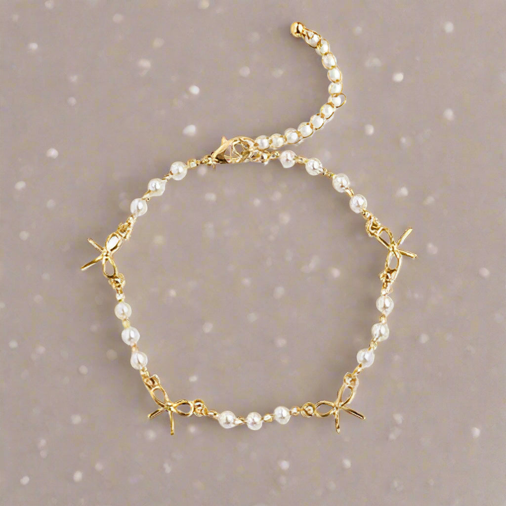 Gold Bow and Pearl Jewelry