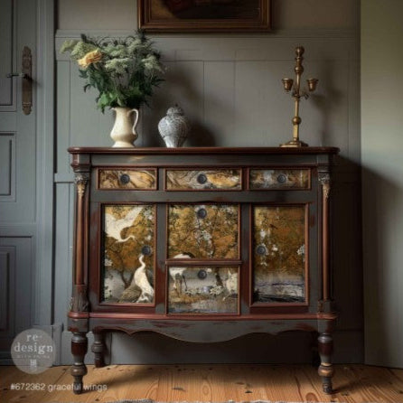 Vintage wooden sideboard with decorative elements in a room setting.