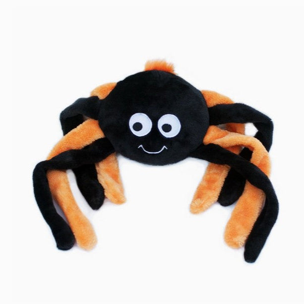 Plush spider toy with black body and orange legs on a white background