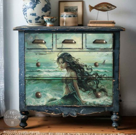 Wooden dresser with mermaid design on a wooden floor