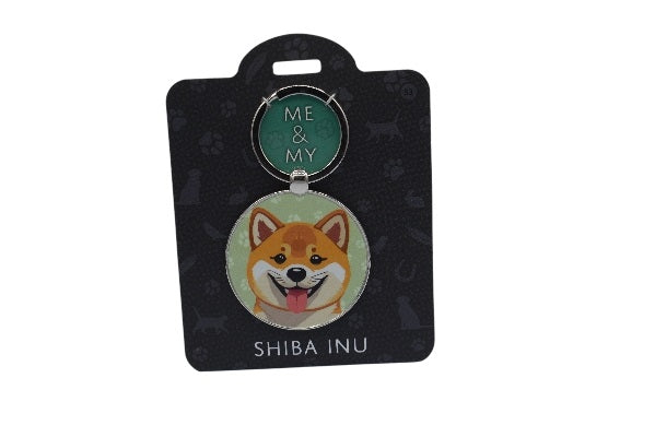 Keychain with Shiba Inu design on a black card
