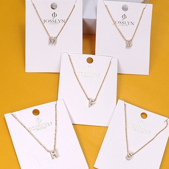 Initial Necklaces on yellow background