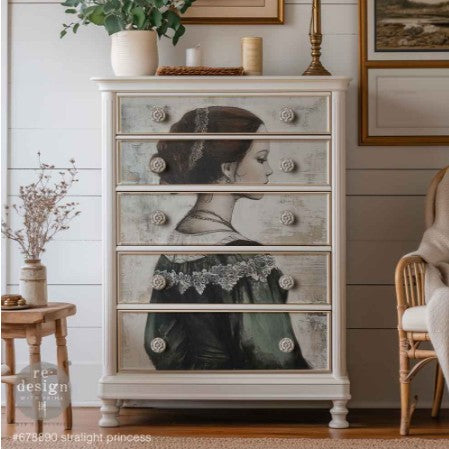 Furniture piece with decal of a woman's face on drawers in a room setting.