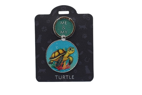 Keychain with turtle design on a black card with 'Me & My' branding