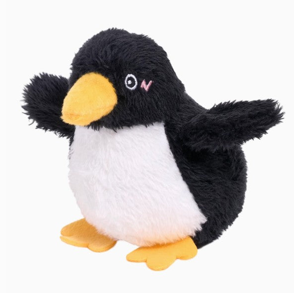 Plush penguin dog toy on a white background