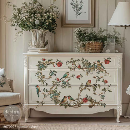 Decorative chest of drawers with floral and bird patterns in a room setting.