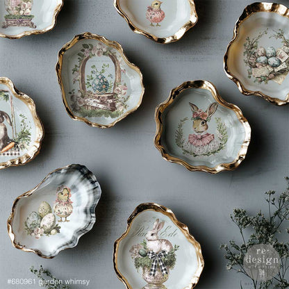 Gold trimmed plates decorated with the Garden Whimsy transfers.