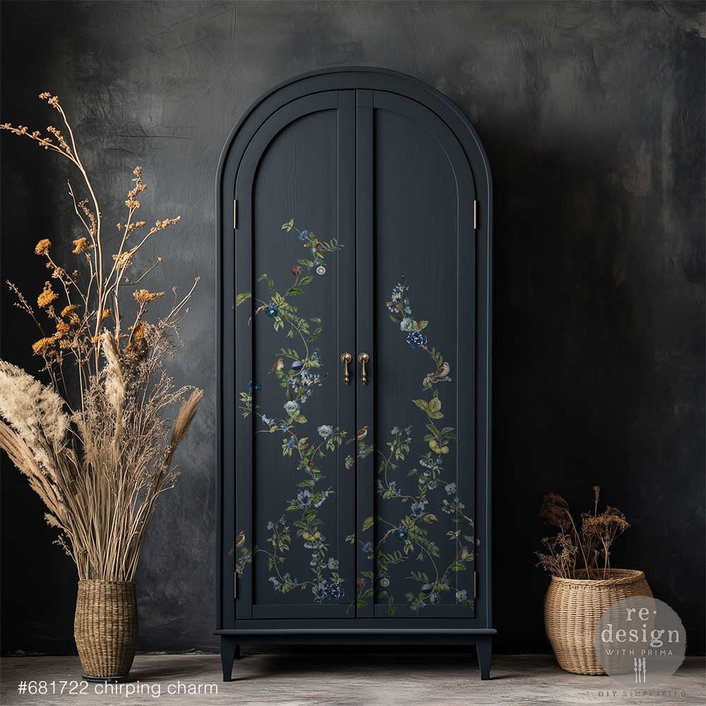 Dark blue armoire with the Chirping Charm transfers against a dark wall, flanked by decorative plants.