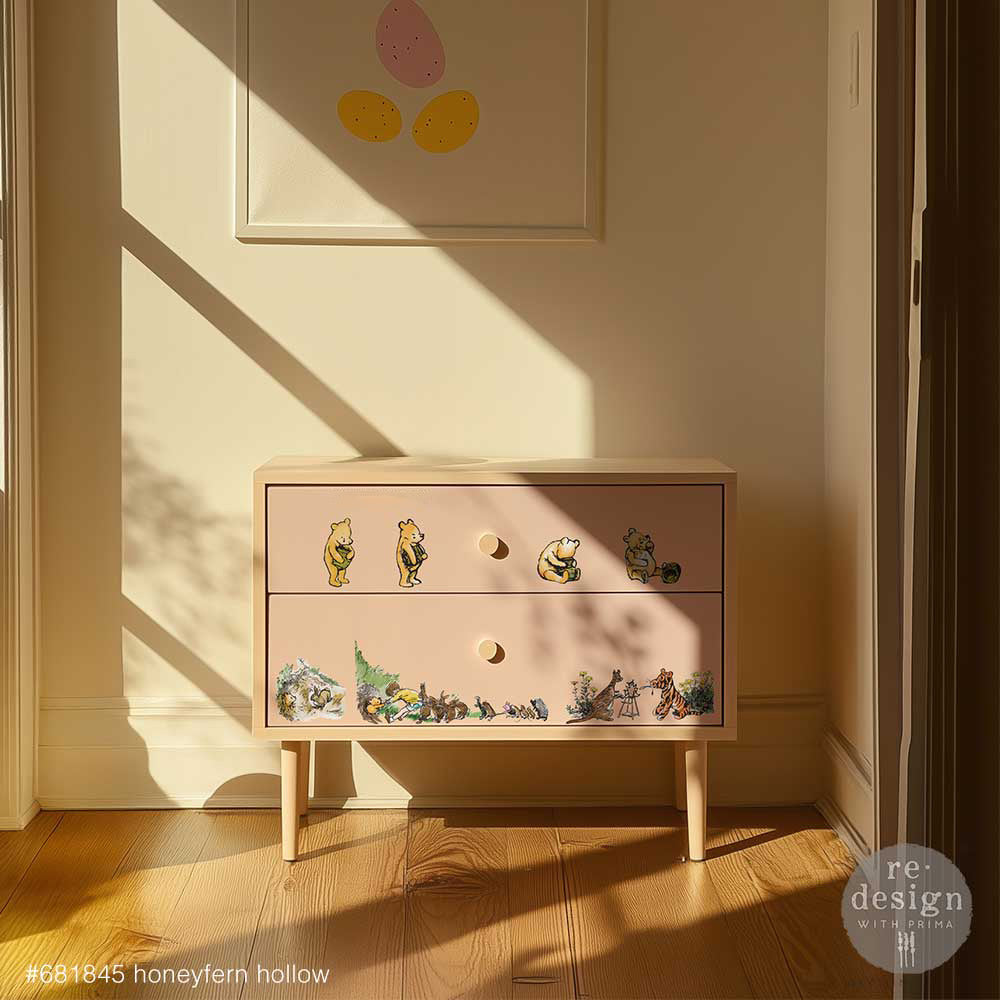 Two drawer dresser with the Honeyfern Hollow transfer on a wall with sunlight coming through window.
