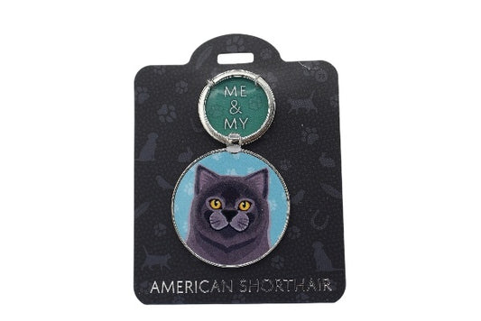 Keychain with an American Shorthair cat illustration on a black card with brand name.