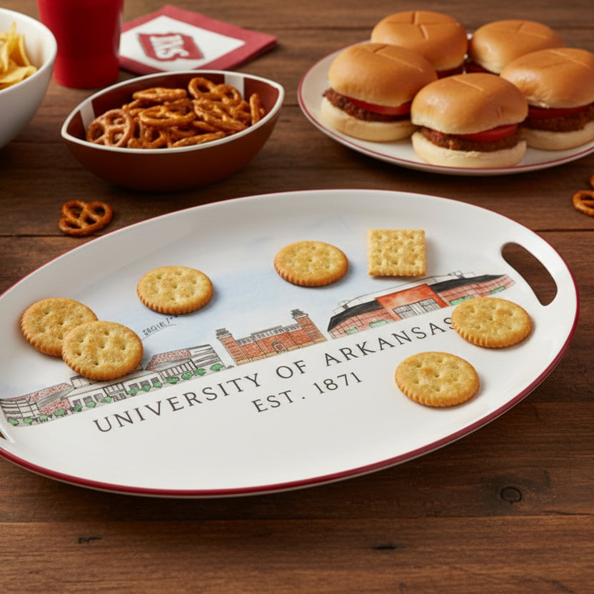 Oval platter with University of Arkansas design on a table with game day food