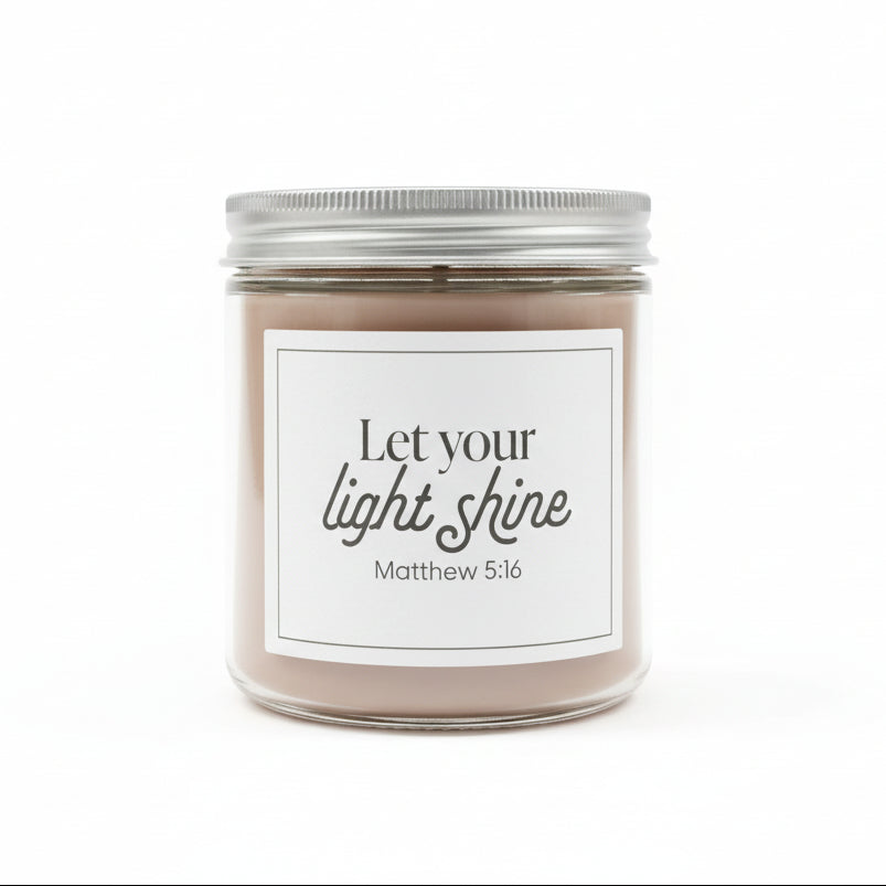 Sweet Grace jar candle with white label and "Let your light shine" in black on a white background