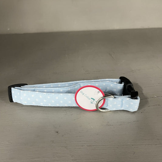 Dog collar with a polka dot pattern on a gray surface