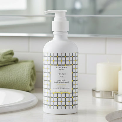 Bottle of Beekman 1802 hand and body wash with a checkered design