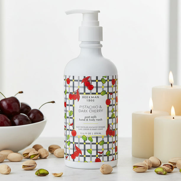 Bottle of goat milk hand and body wash with cherry design