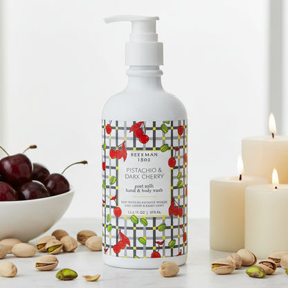 Bottle of goat milk hand and body wash with cherry design