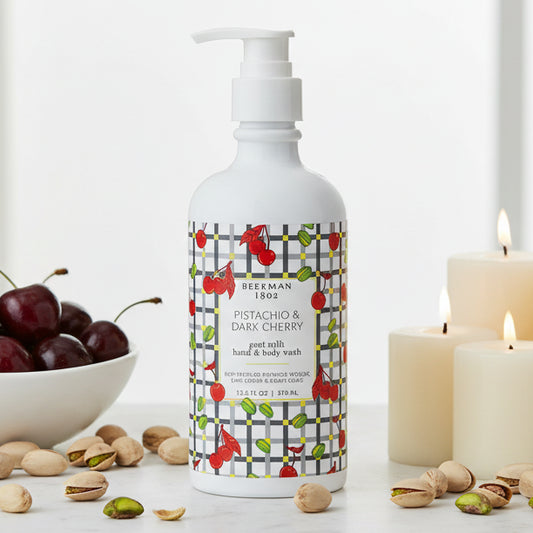 Bottle of goat milk hand and body wash with cherry design