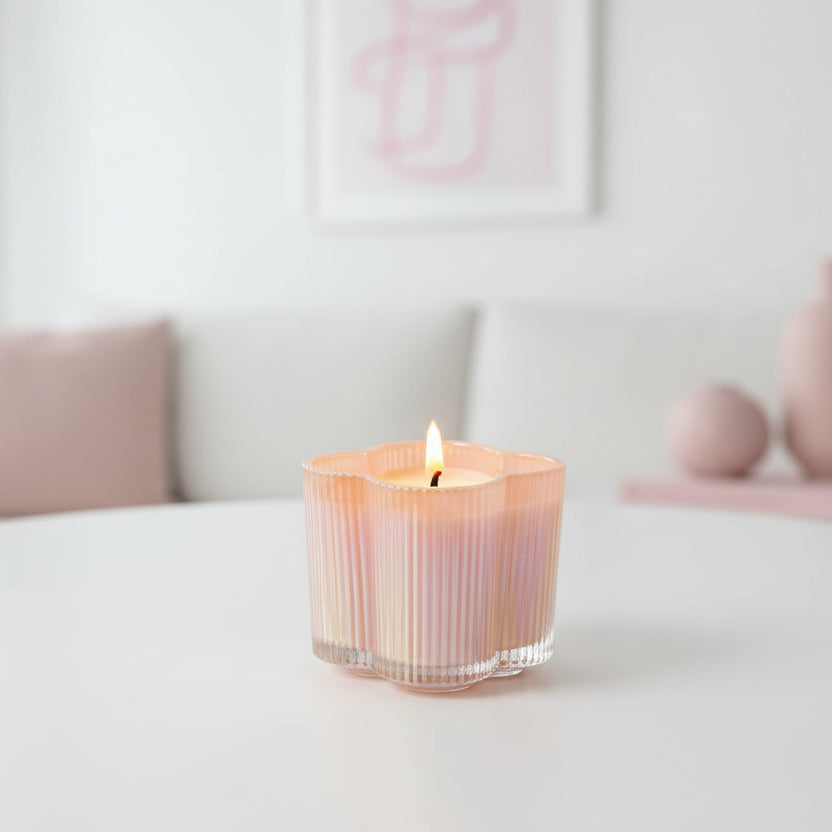 Sweet Grace Candle #075 shown on a table with a living room in the background