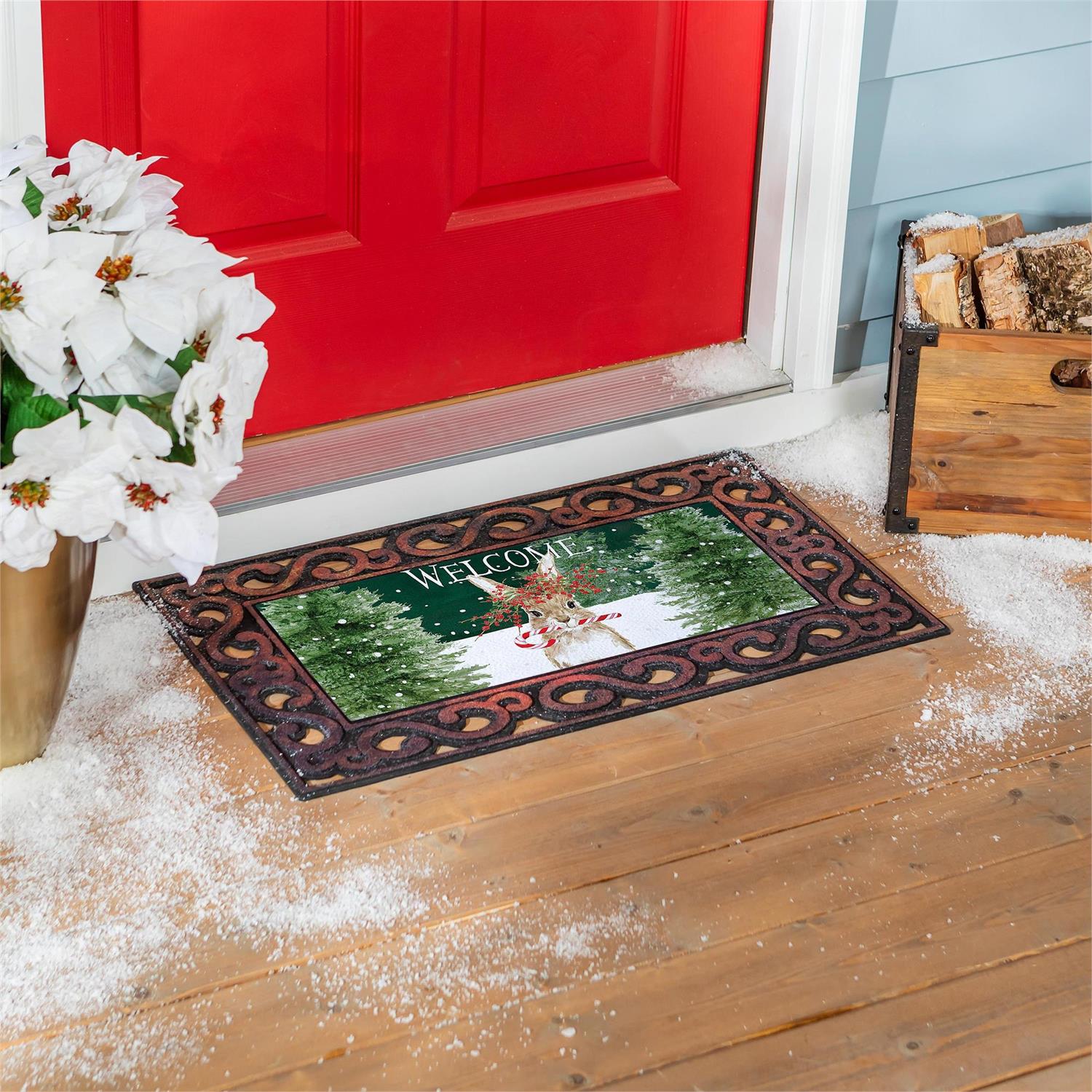 Decorative doormat with winter scene and 'Welcome' text in front of a red door.