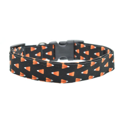 dog collar with black background featuring candy corn and a black buckle on a white background