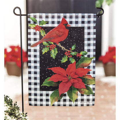 Christmas-themed garden flag with cardinal and poinsettia on a checkered background