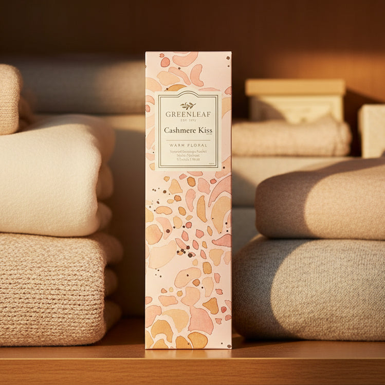 Greenleaf Cashmere Kiss slim sachet on a closet shelf with blankets and warm sunlight.