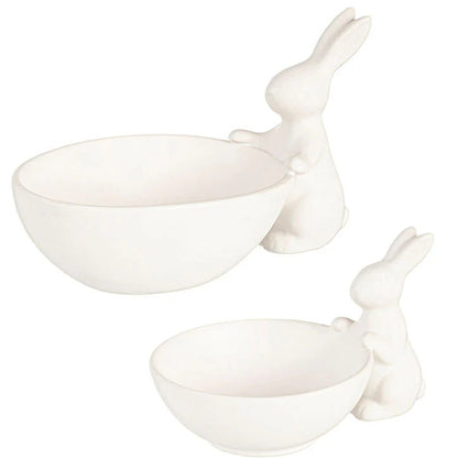 Two white ceramic rabbit bowls on a white background