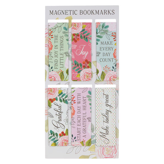 Packaging of magnetic bookmarks with floral and motivational designs.