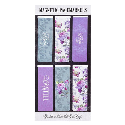 Set of magnetic page markers with floral and text designs on a white background