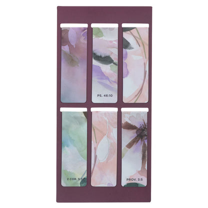 Floral design bookmarks in a purple holder on a white background