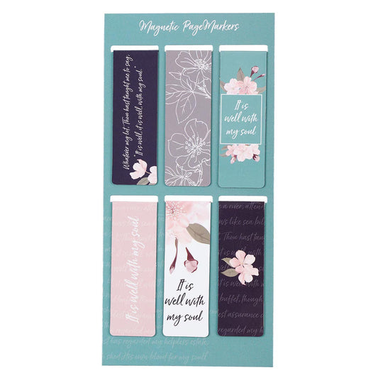 Set of floral and text magnetic page markers on a teal background