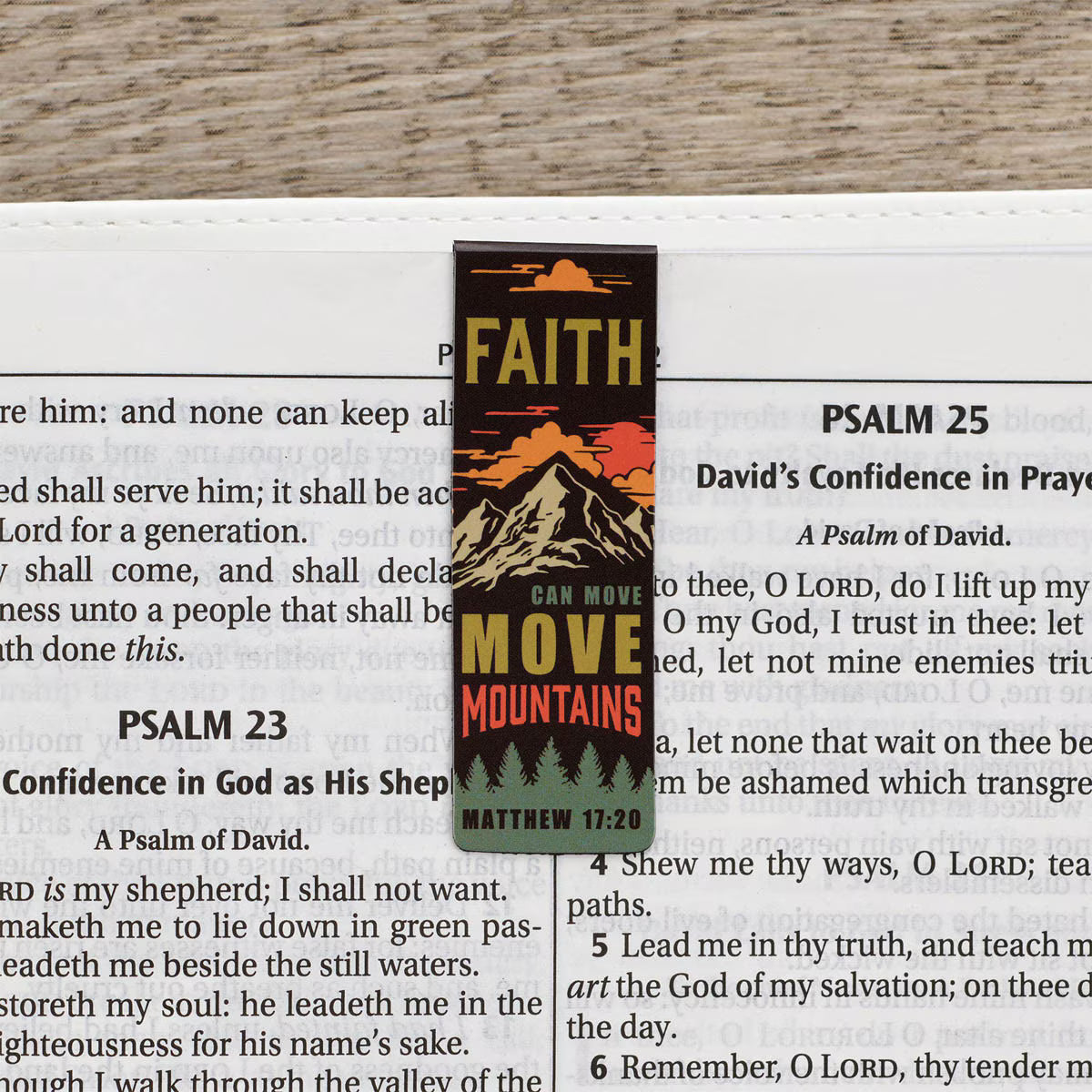 Bookmark with 'Faith Can Move Mountains' text on a Bible