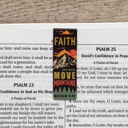 Bookmark with 'Faith Can Move Mountains' text on a Bible