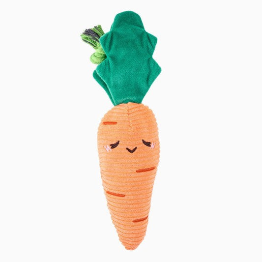 Carrot-shaped plush dog toy with a green top on a white background