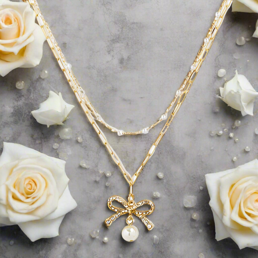 Gold Bow and Pearl Jewelry