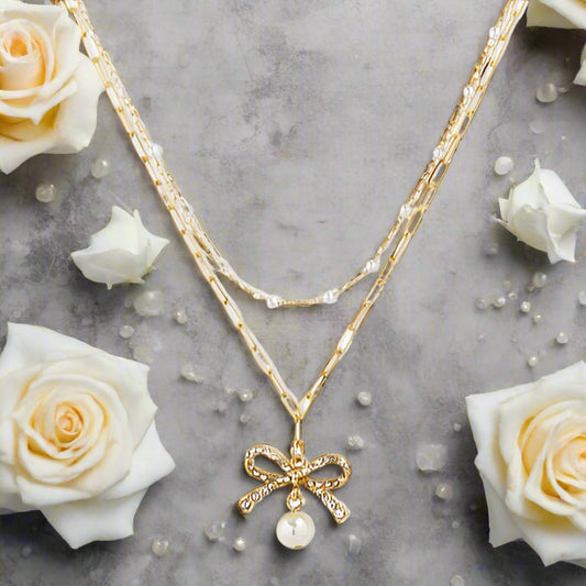 Gold Bow and Pearl Jewelry