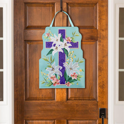 Easter Cross door hanger designed  with flowers hanging on a wooden door.