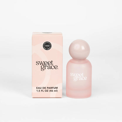 Pink 'sweet grace' eau de parfum bottle and packaging on a white background