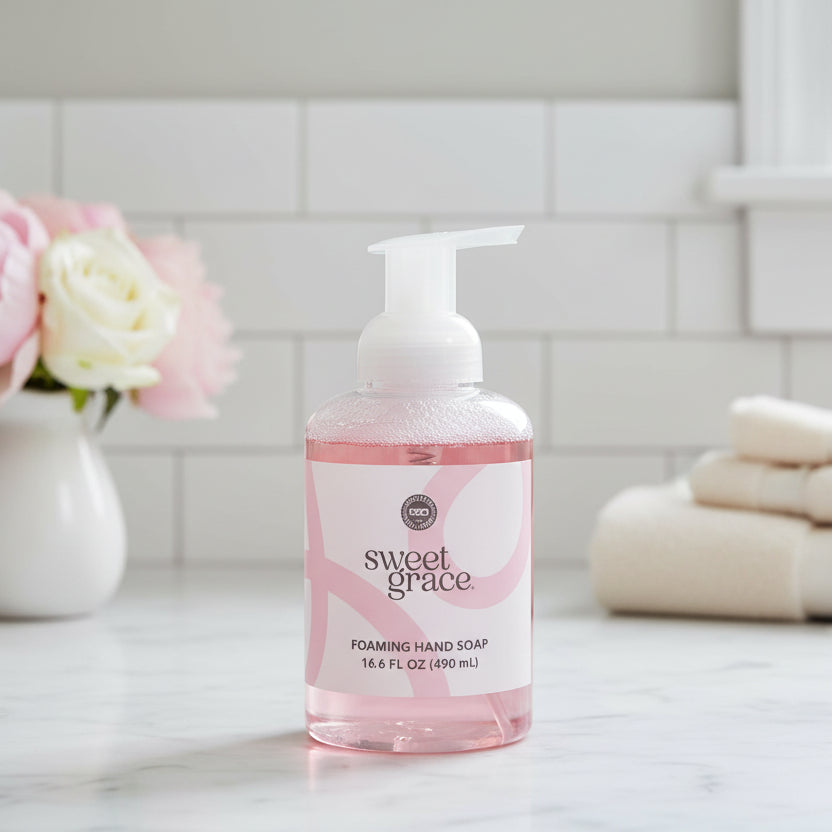 A bottle of Sweet Grace Foaming Hand Soap shown on a bathroom counter