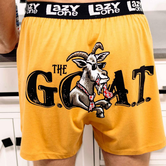 Yellow shorts with a goat graphic and 'Lazy One' branding on the waistband.