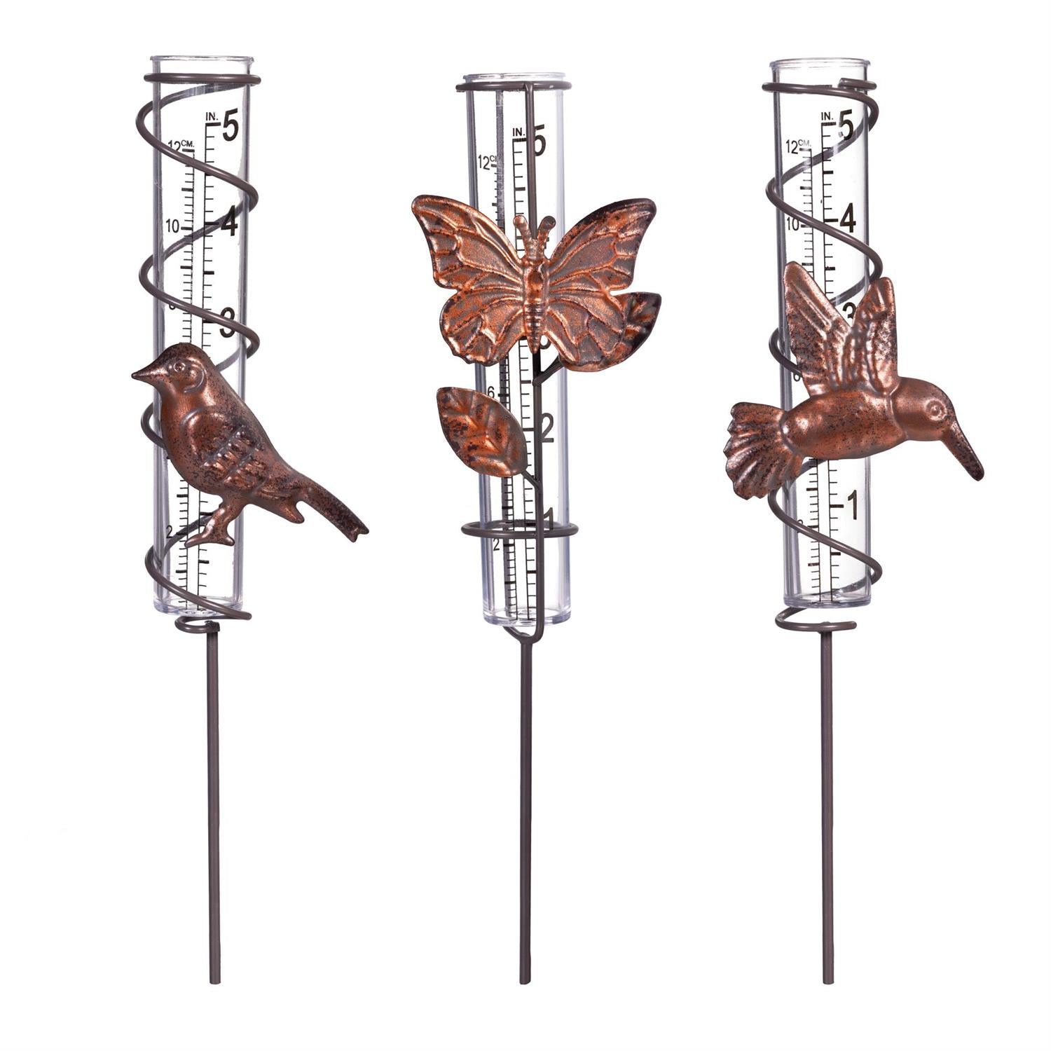 Three decorative rain gauges with bird, butterfly, and hummingbird designs on a white background.