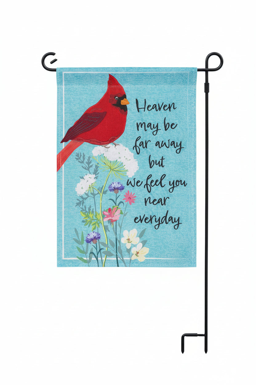 Evergreen Cardinal Memorial garden flag with cardinal bird on a floral design with text saying "Heaven may be far away but we feel you near everyday" with a blue background.