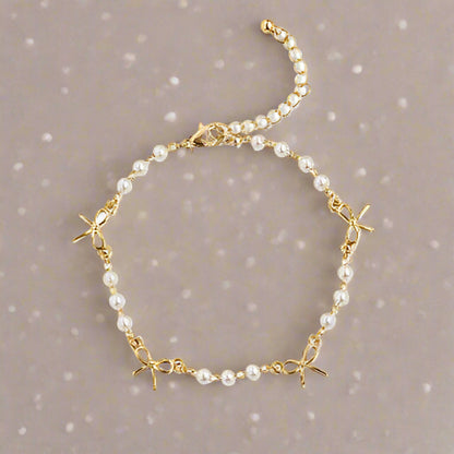 Gold Bow and Pearl Jewelry