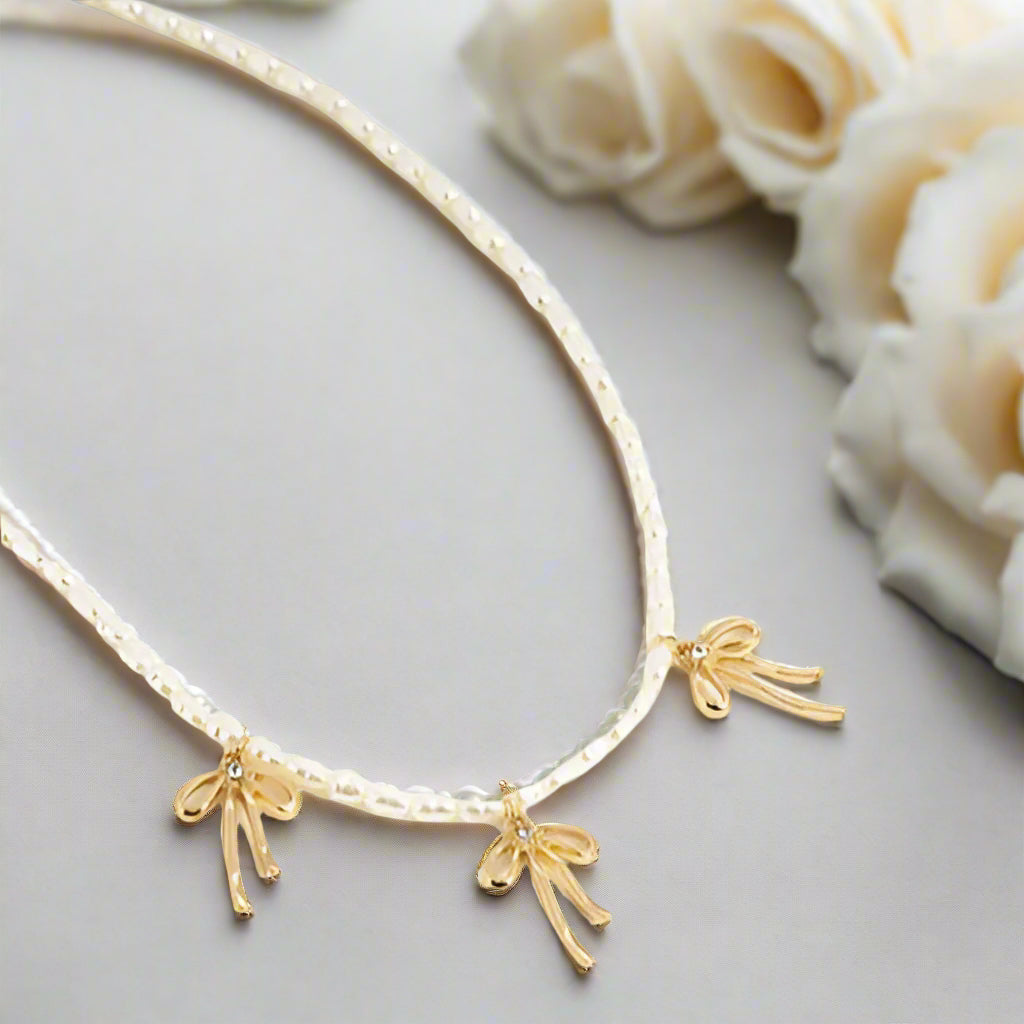 Gold Bow and Pearl Jewelry