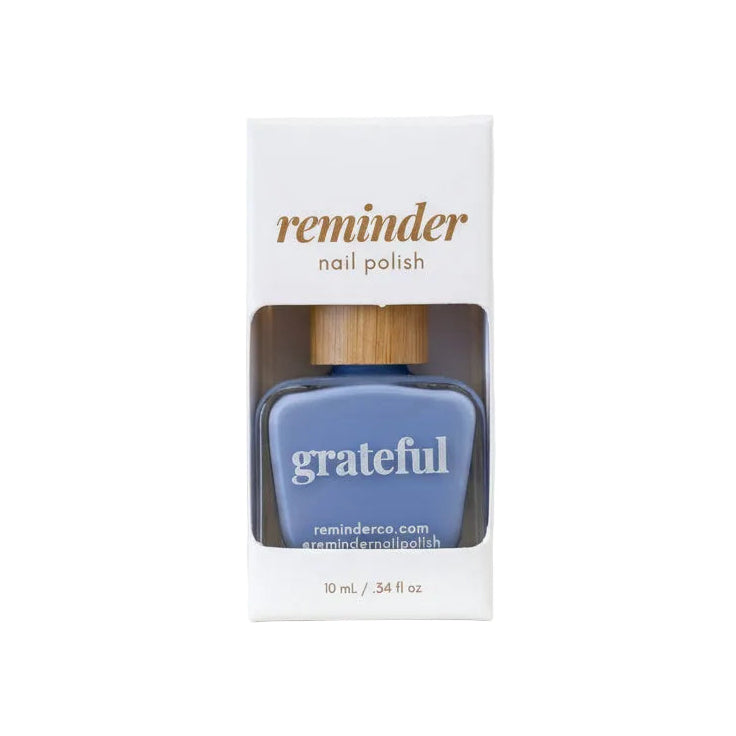 Reminder Nail Polish in Grateful Cornflower Blue on a white background.