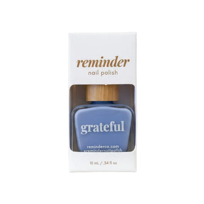 Reminder Nail Polish in Grateful Cornflower Blue on a white background.