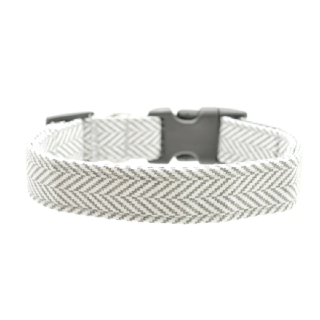 Woven herringbone dog collar with a black buckle on a white background